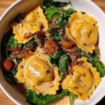 Craving an easy gourmet pasta night? Learn how to transform Trader Joe's Ricotta and Lemon Zest Ravioli with Burst Tomatoes and Burrata into a restaurant-worthy meal in minutes. Try now!